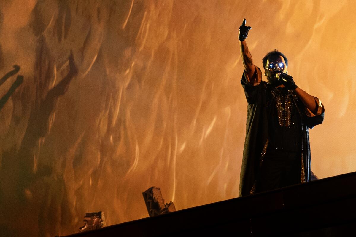 Man pointing upward, with a glowing mask