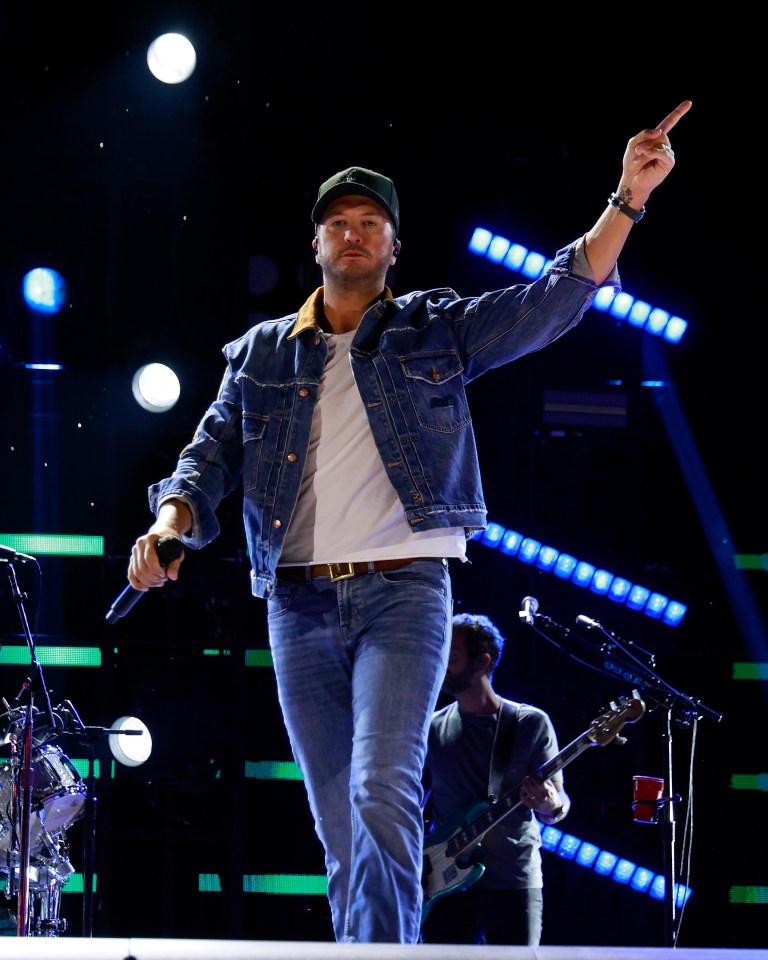 Luke Bryan performing at a concert.