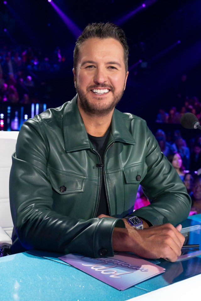Luke Bryan performing at a concert.