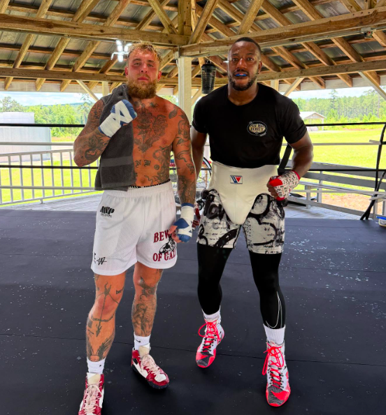 Two boxers in boxing gear.