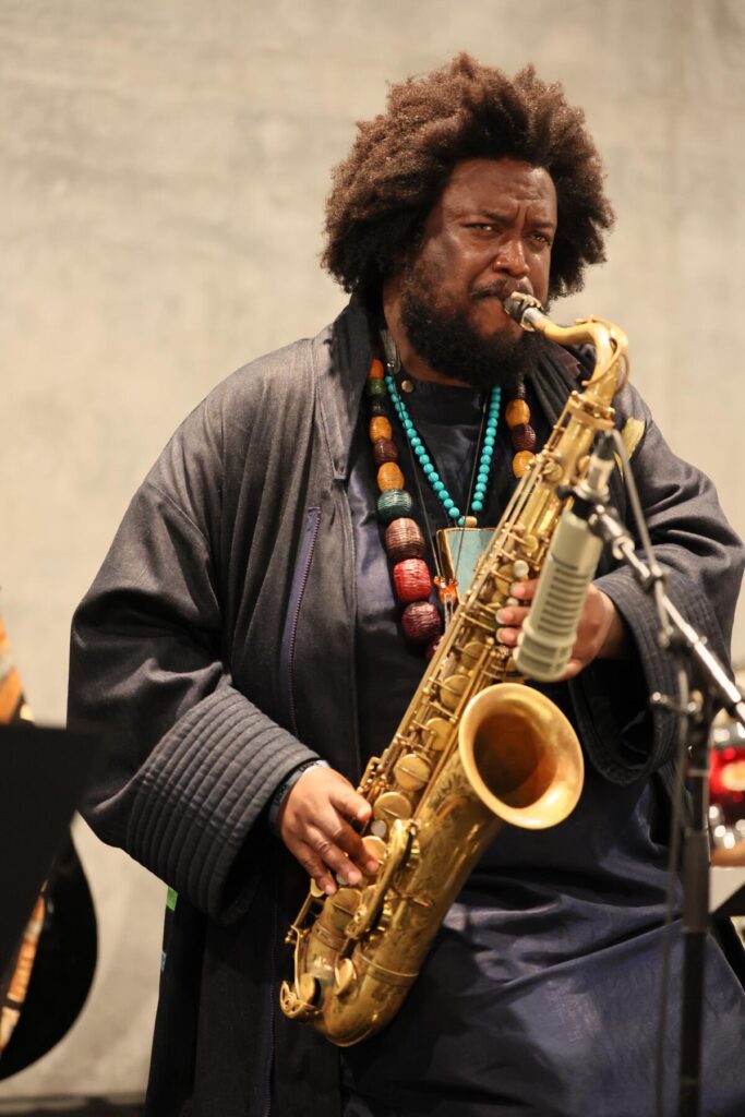 Kamasi Washington plays saxophone as LACMA previews its new main building to media and museum members.