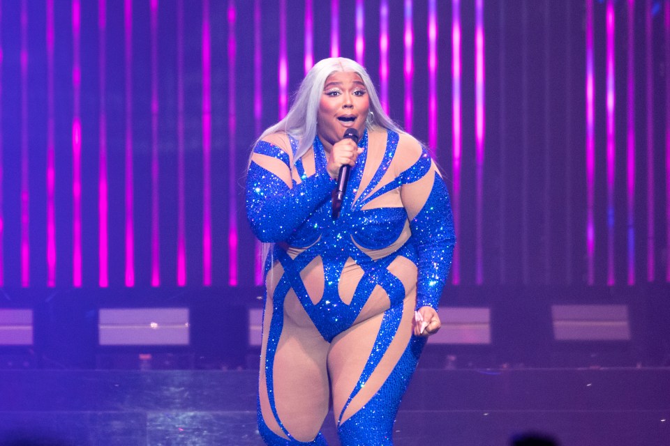 Lizzo performing on stage.