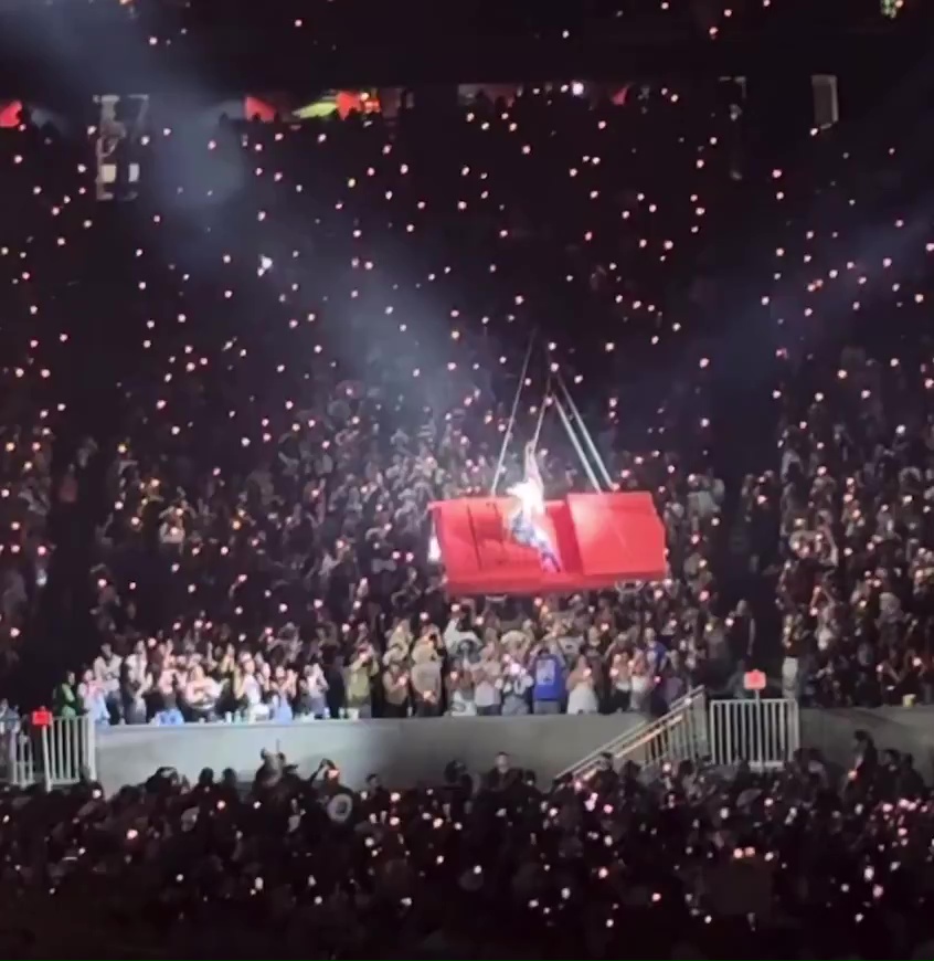 Beyoncé in a tilting flying car during a concert.