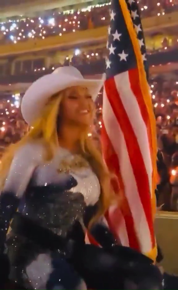 Beyoncé performing in a sparkly bodysuit and cowboy hat.