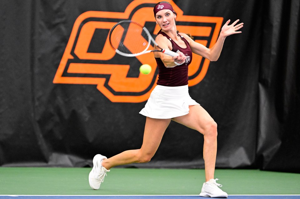 Carson Branstine of the Texas A&M Aggies playing tennis.