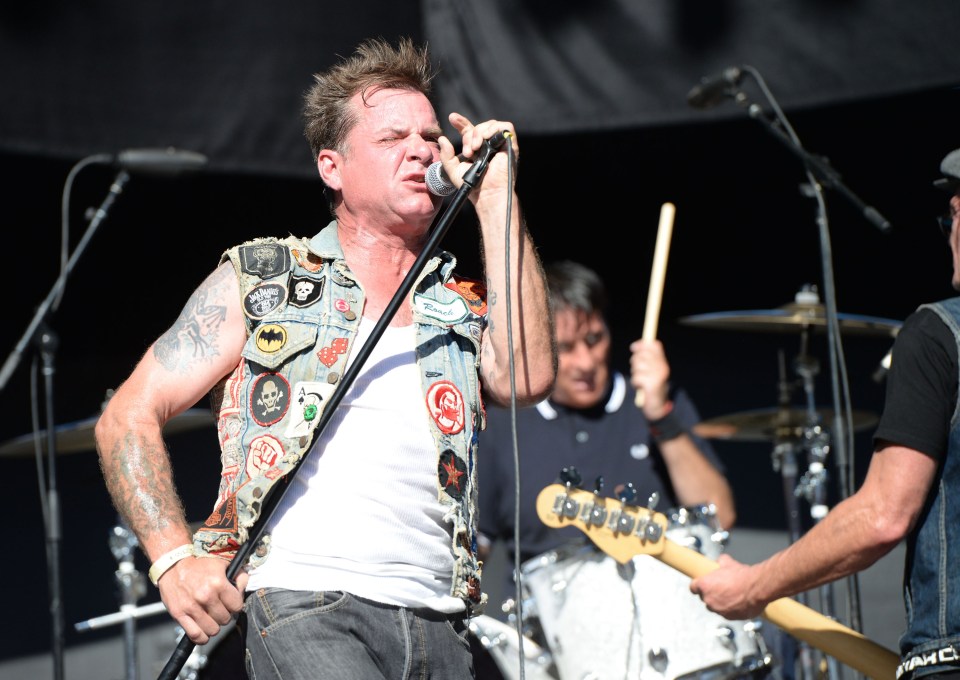 David Roach, singer of Junkyard, performing at a concert.