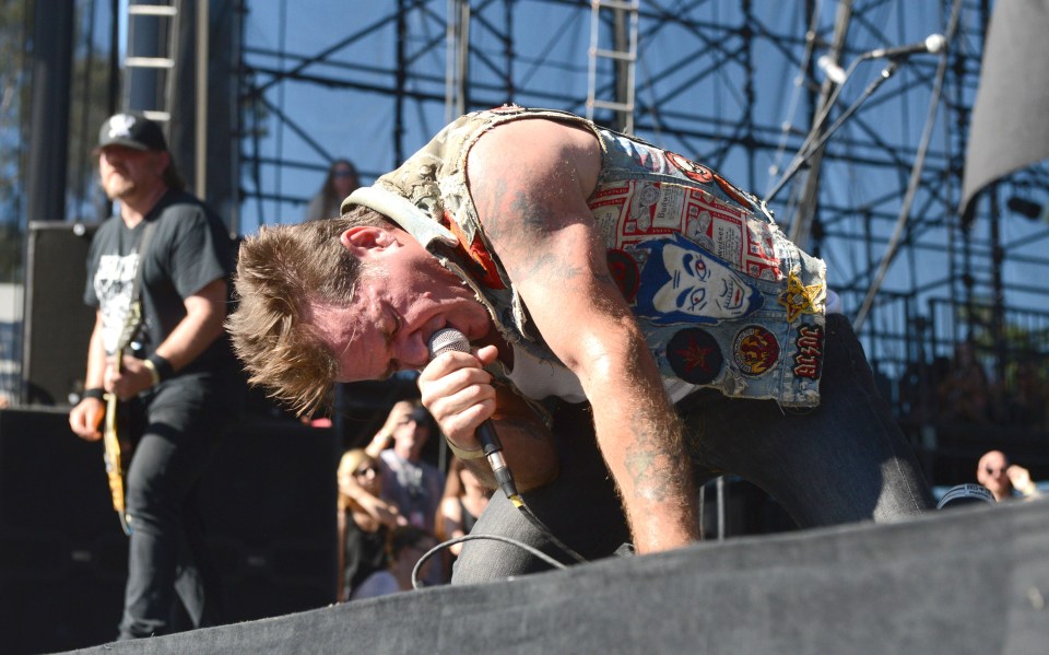 David Roach of Junkyard performing at a concert.