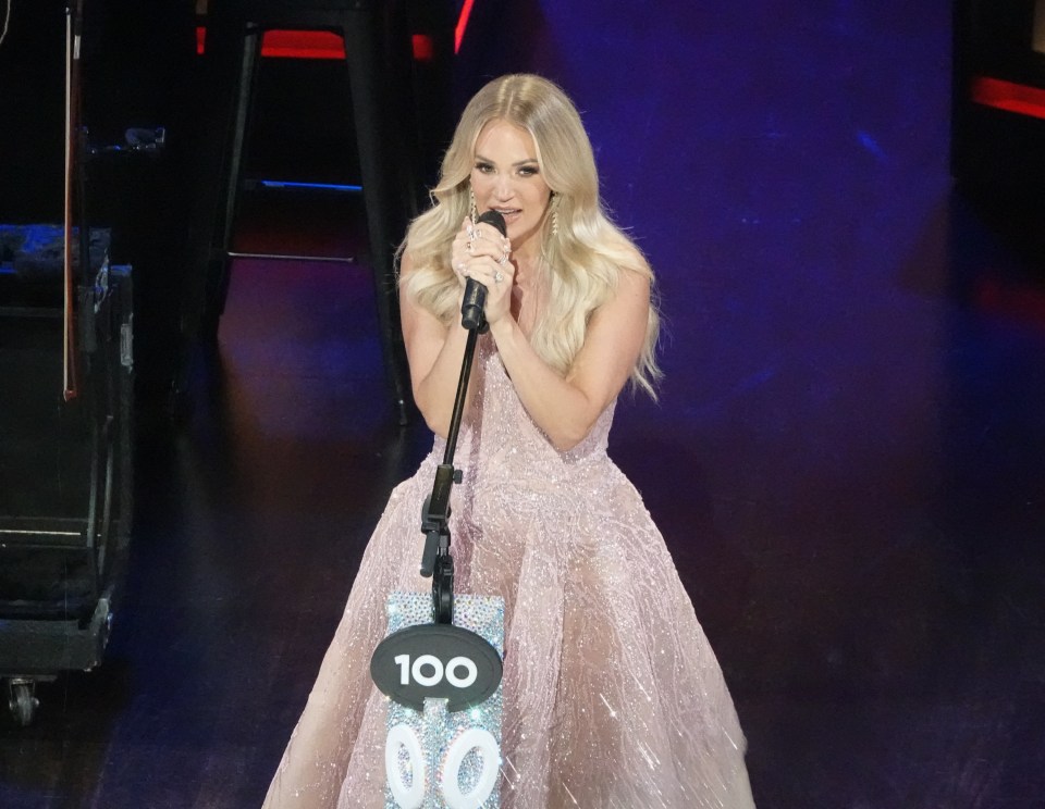 Carrie Underwood performing on stage.