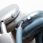 Close shots of the buttons on two sets of headphones.