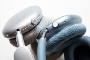 Close shots of the buttons on two sets of headphones.