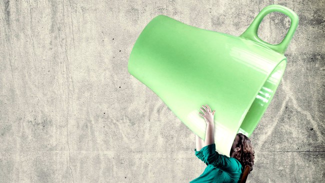 man-drinking-out-of-giant-cup