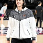 Caitlin Clark #22 of the Indiana Fever walks onto the court before the game against the Washington Mystics at CFG Bank Arena on May 28, 2025 in Baltimore, Maryland.