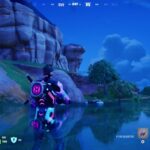 A Fortnite screenshot depicting Lewis Hamilton waiting through west deep water at the bottom of a gorge.