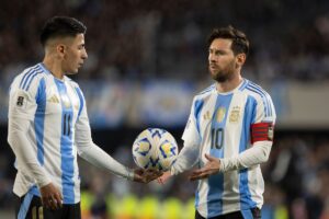 Argentina's Lionel Messi and Thiago Almada participate in the 2026 FIFA World Cup South American qualifiers football match between Argentina and Colombia at the Mas Monumental stadium in Buenos Aires, Argentina, on June 10, 2025