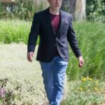 Jeff Cohen, who played Chunk in *The Goonies*, walking down a sidewalk.