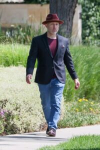 Jeff Cohen, who played Chunk in *The Goonies*, walking down a sidewalk.