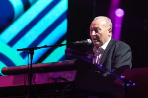 James Prime of Deacon Blue performing on stage.