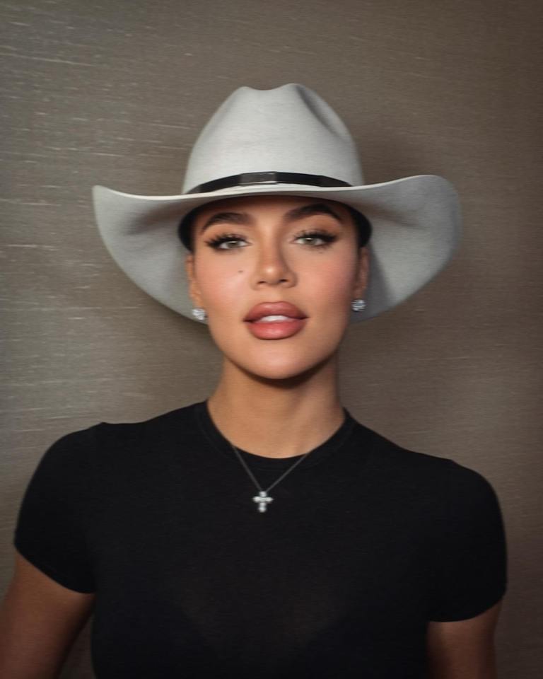 Khloe Kardashian wearing a cowboy hat and black shirt.