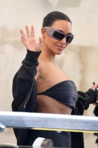 Kim Kardashian waving.
