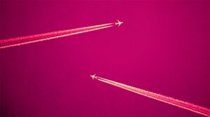 Two-white-jets-flying-and-leaving-chemtrails