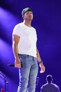 Luke Bryan performing at a concert.