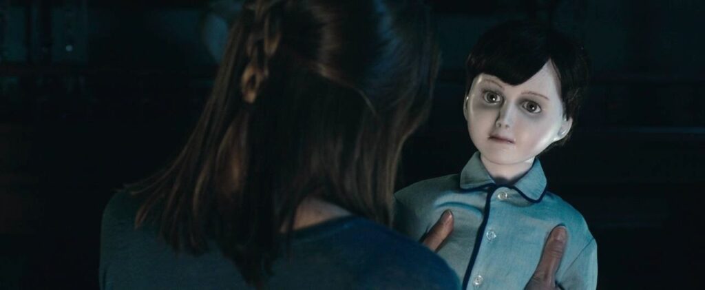 A woman holds Brahms in The Boy