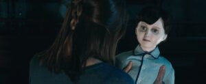 A woman holds Brahms in The Boy