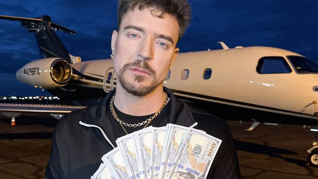 MrBeast holds a spread of cash against a private jet in the background.