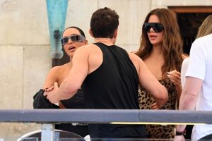 Kim and Khloe Kardashian with a man in Venice.