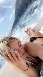 Olivia Dunne sunbathing on a yacht in Capri, Italy.