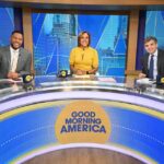 Photo of Michael Strahan, Robin Roberts, and George Stephanopoulos on the set of Good Morning America.