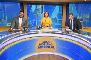 Photo of Michael Strahan, Robin Roberts, and George Stephanopoulos on the set of Good Morning America.