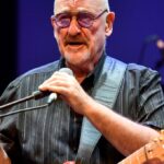 Dave Mason, Rock and Roll Hall of Fame inductee, performing onstage.
