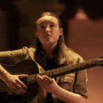A still photo of Bella Ramsey in the HBO series The Last of Us.
