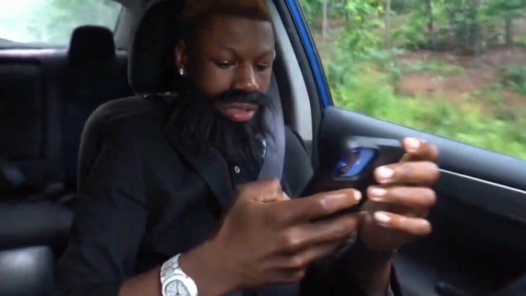 Twitch star RaKai under fire for staring at his phone & almost crashing car on stream