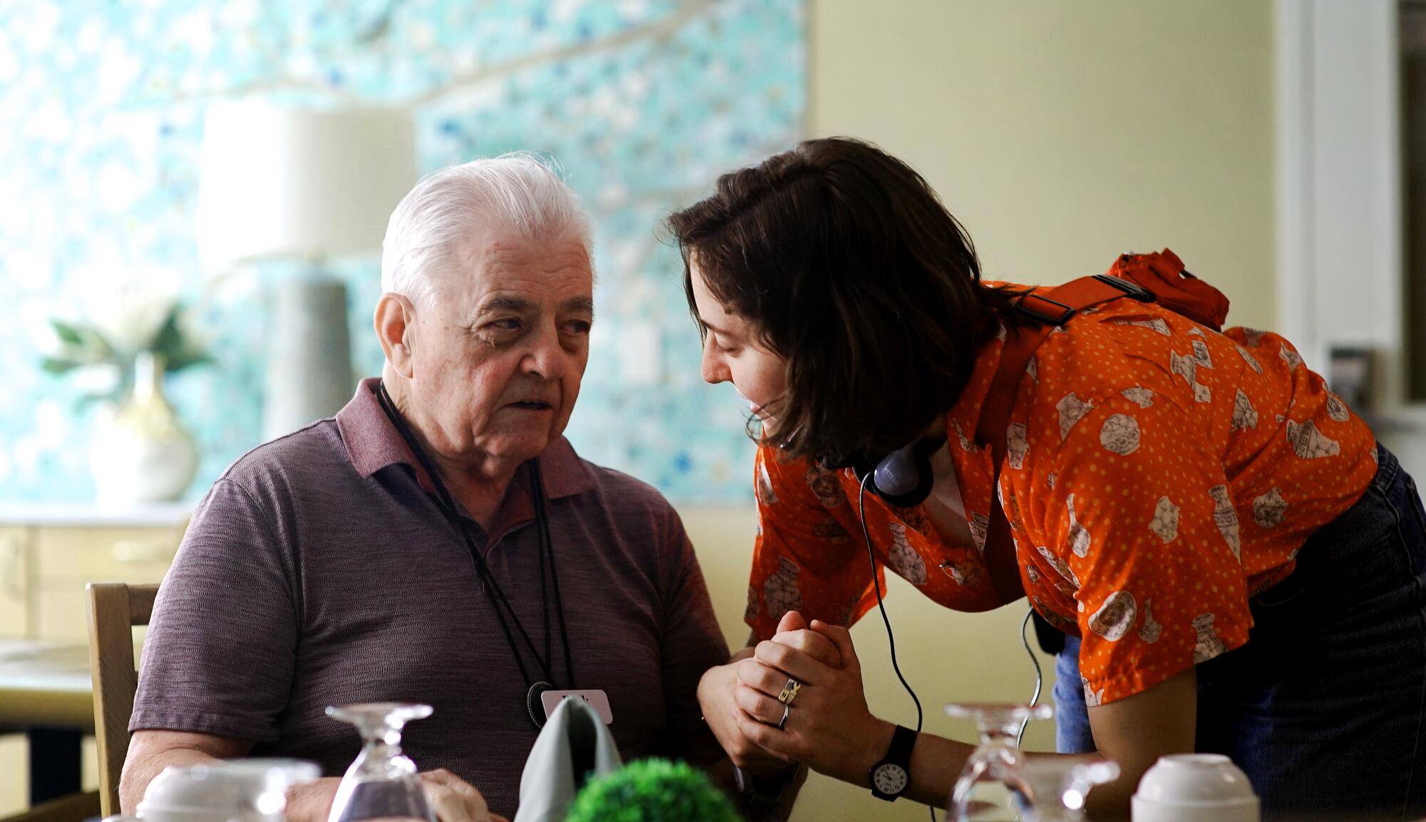Director Sarah Friedland, right, works with a Villa Gardens resident while filming "Familiar Touch."