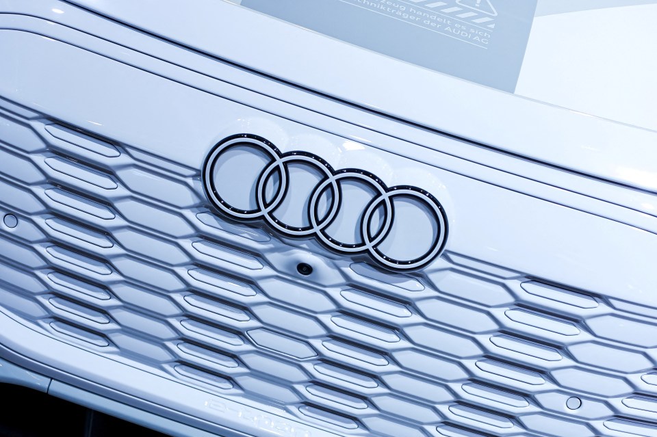 Audi logo on a white car grill.