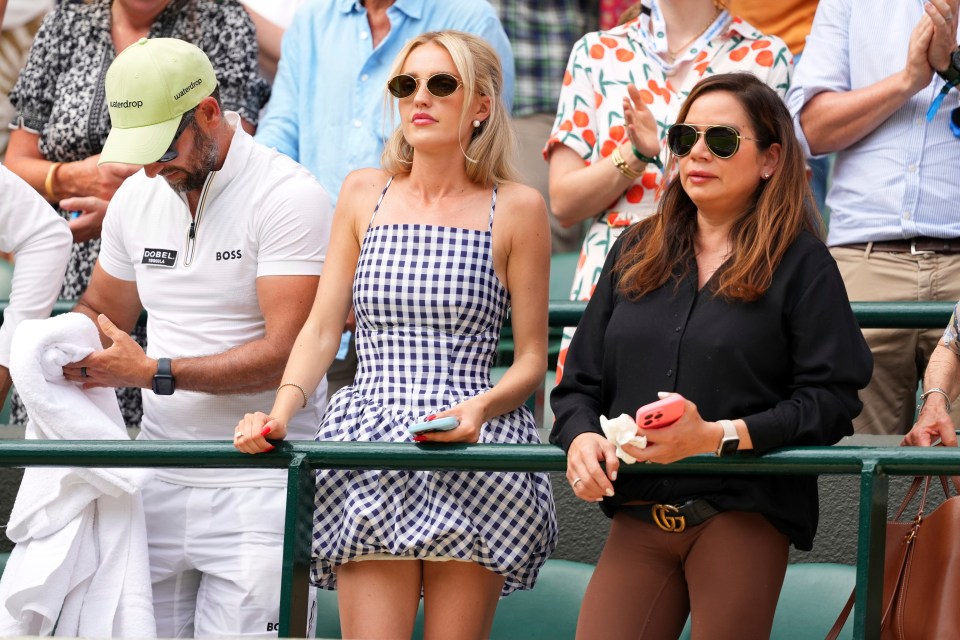 Morgan Riddle, Taylor Fritz's girlfriend, watching a tennis match.