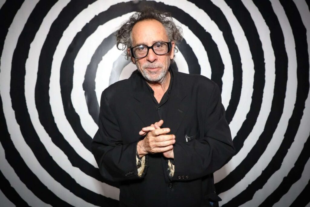 image of tim burton infront of a black and white bullseye