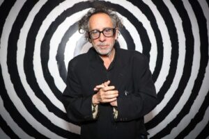 image of tim burton infront of a black and white bullseye