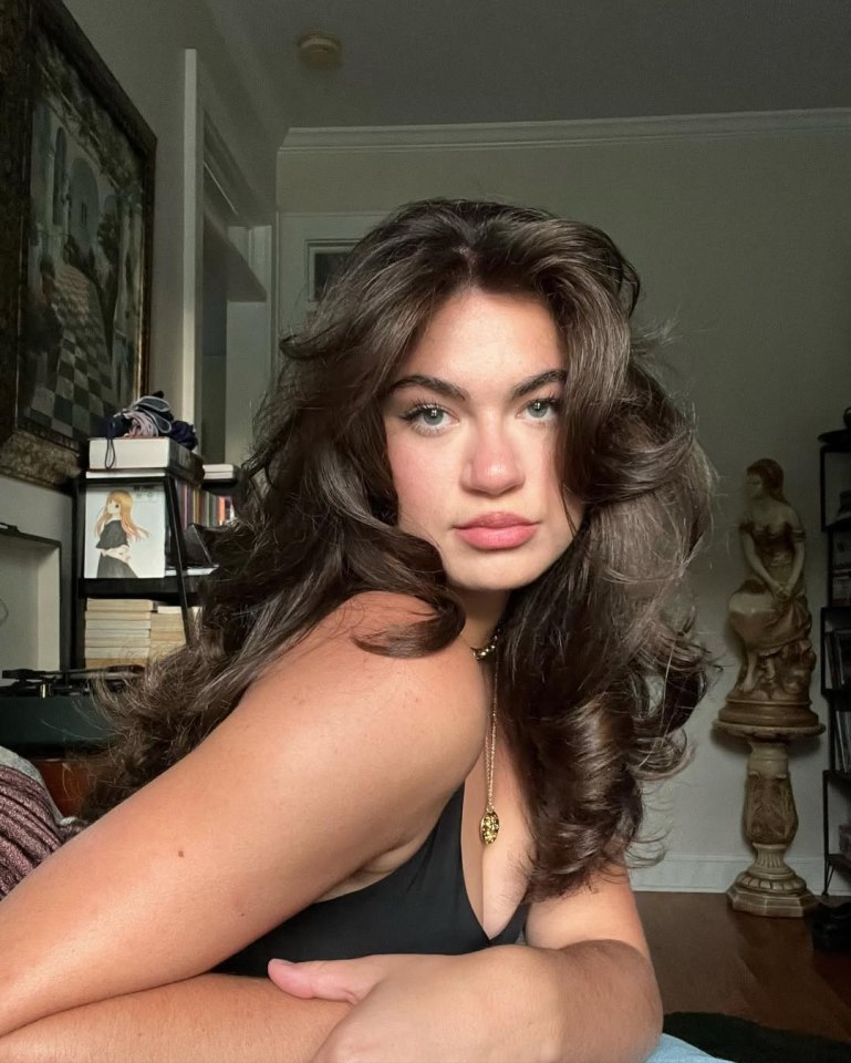 Portrait of a young woman with long brown hair.