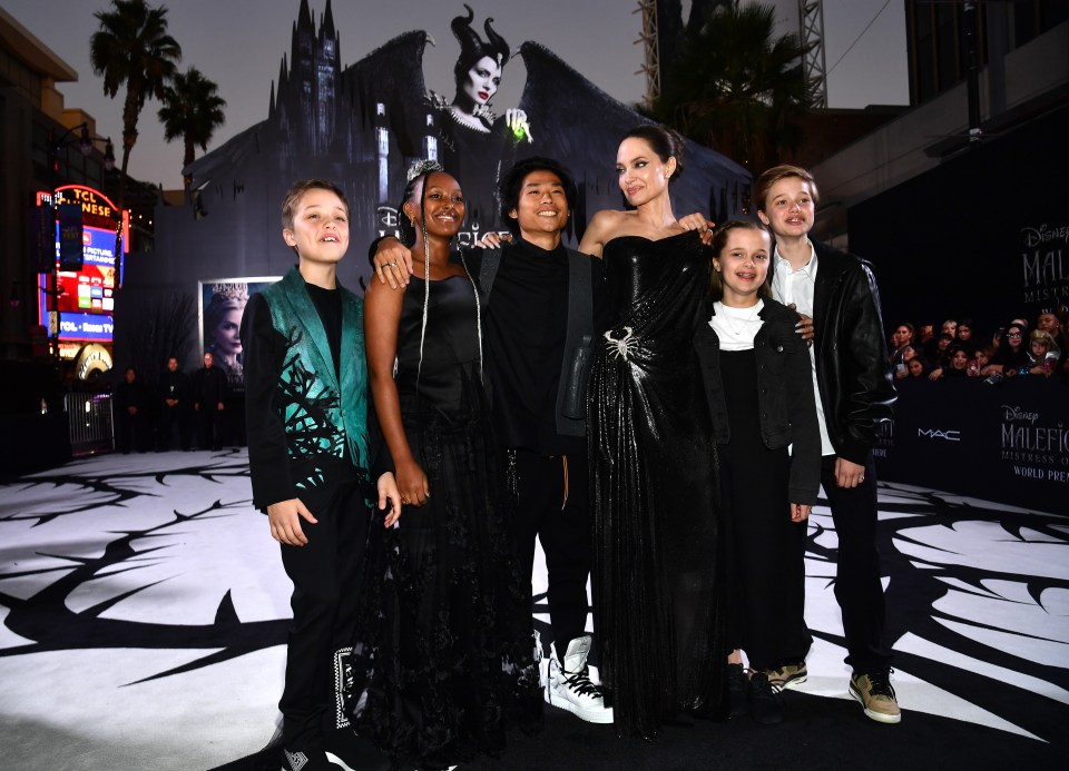Angelina Jolie with her children at a movie premiere.