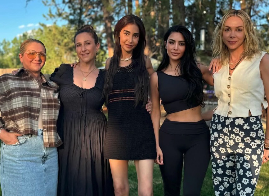 Kim Kardashian and four friends posing for a photo.