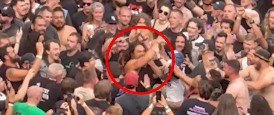Jason Momoa in a mosh pit at a Black Sabbath concert.