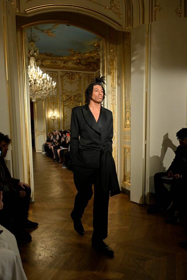 Henry Klum walking a runway.
