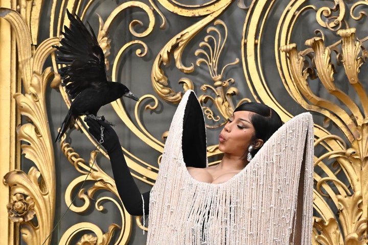 Cardi B and the bird share a moment together.
