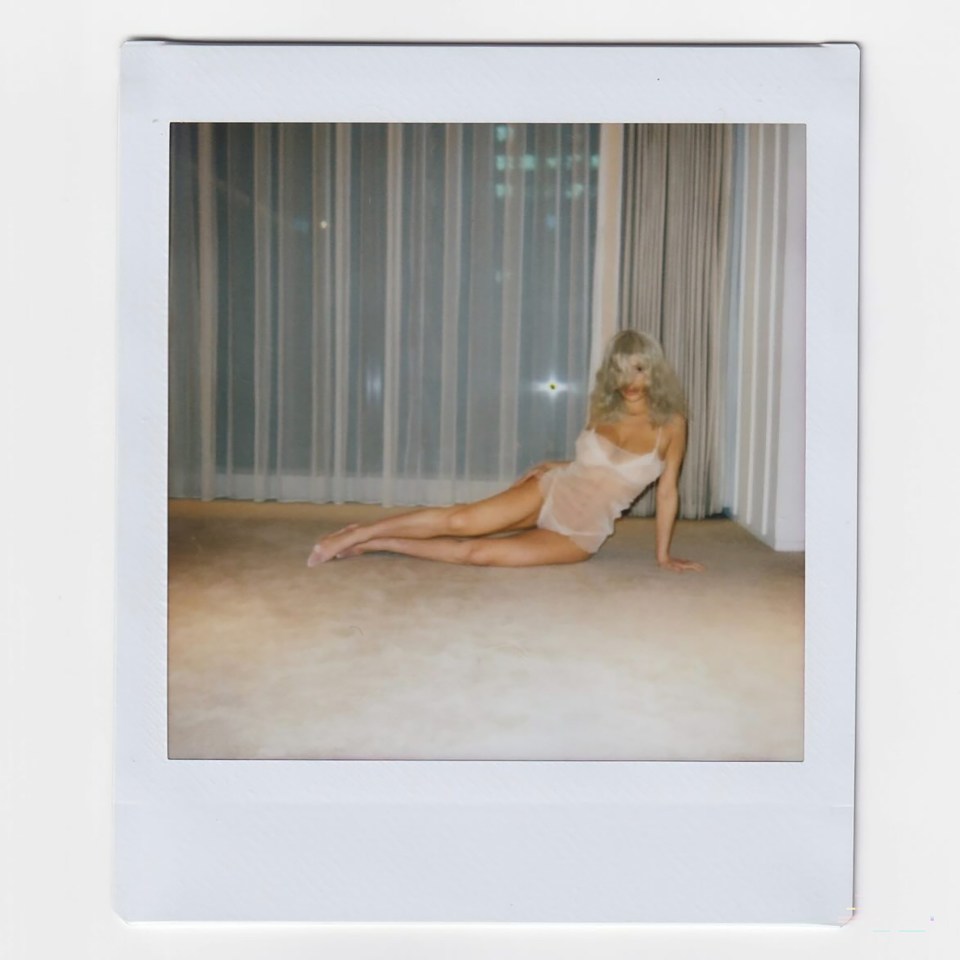 Polaroid photo of Bianca Censori in a sheer nightgown.