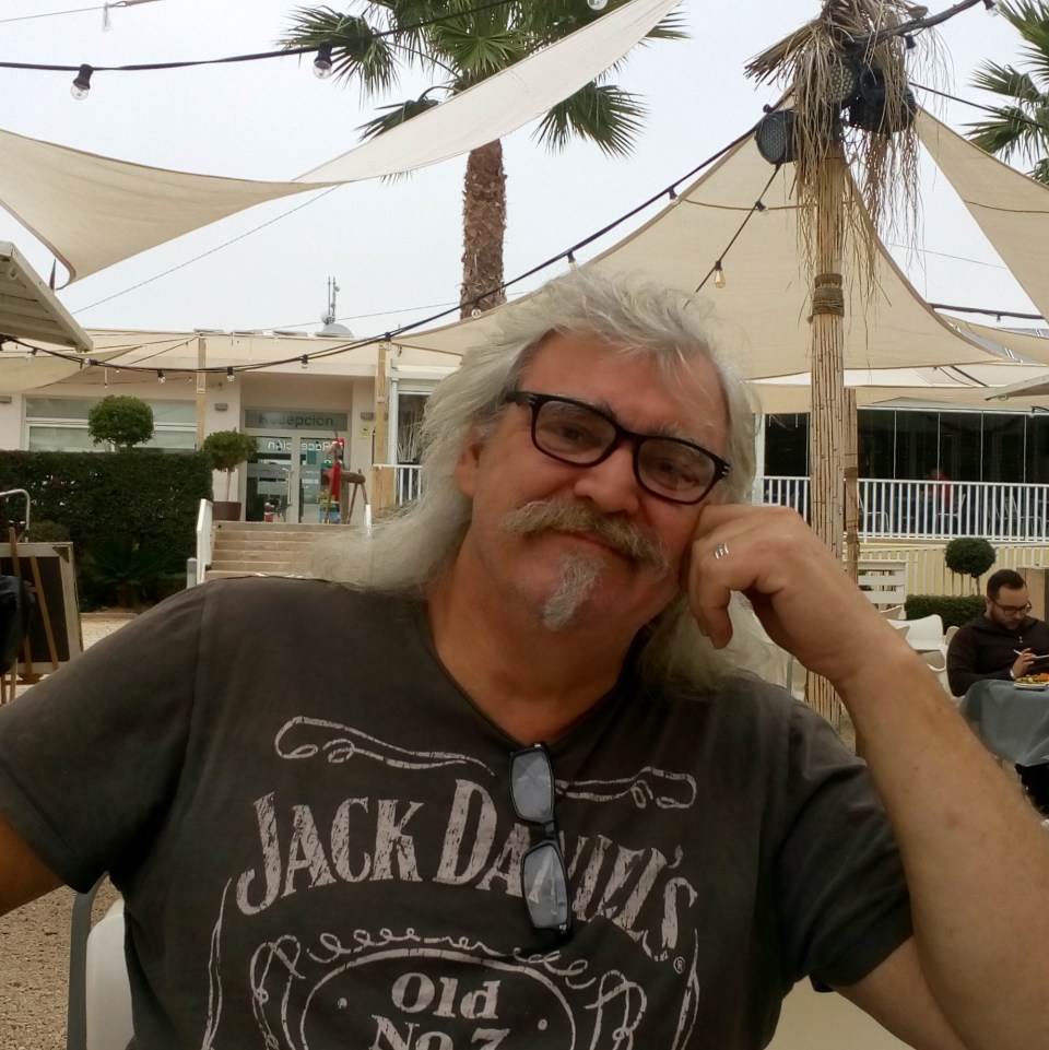 Kevin Riddles, bassist for ICON GONE Legendary Angel Witch, wearing a Jack Daniels t-shirt.