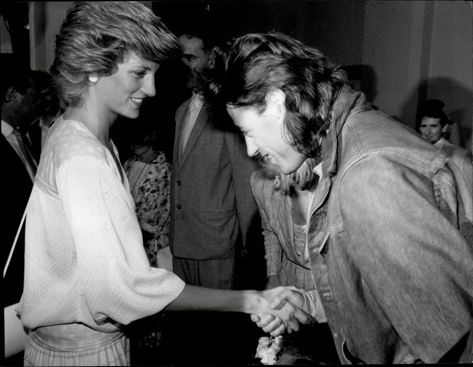 Princess Diana shaking hands with Bob Geldof at Live Aid.