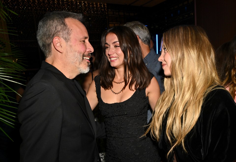 Denis Villeneuve, Ana de Armas, and Sydney Sweeney at a party.